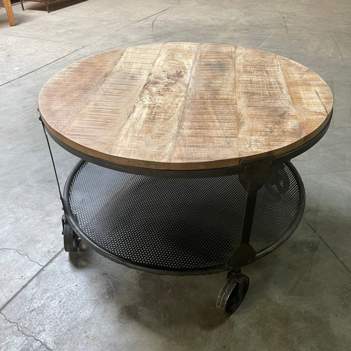 Crenay Round Mango Wood Coffee Table on wheels - Rustic Furniture Outlet